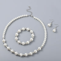 Simulated White Pearl and Resin Stretch Bracelet and Earring and Necklace 21-23 Inches in Silvertone & Stainless Steel