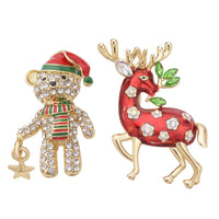 Set of 2 Austrian Crystal, White & Green Glass and Enameled Reindeer & Christmas Boy Brooch in Goldtone