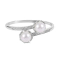 Simulated Pearl and Simulated Diamond Bypass Bangle Bracelet in Silvertone (7.0 In) 0.70 ctw - Sticky add to cart bar