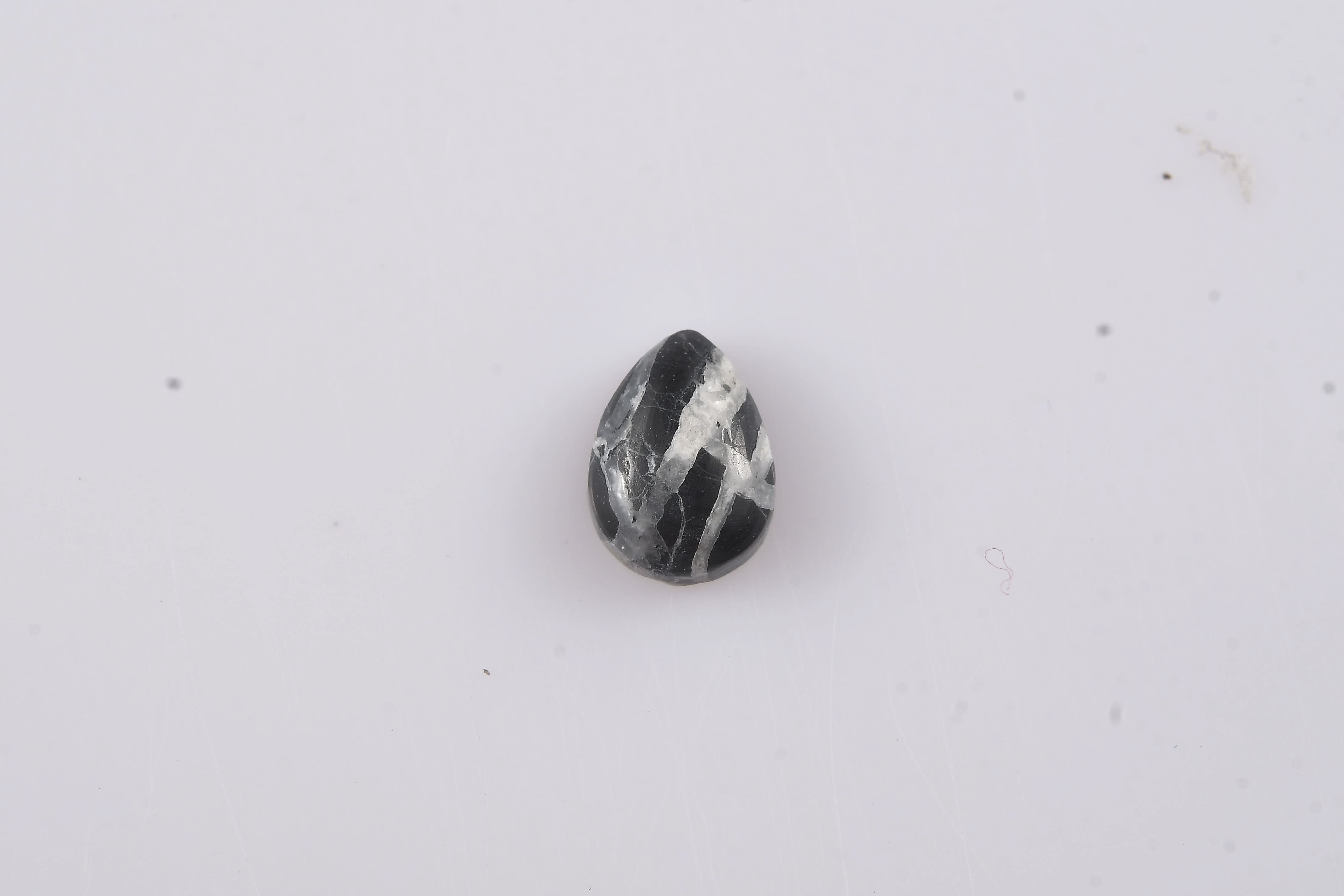 White Buffalo (Pear 7x5 mm) 0.65 ctw Loose Gemstone